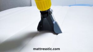 A person cleaning and maintaining their memory foam topper 